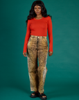 Kandia is 5'3" wearing XS Leopard Work Pant with the Chili Red Long Sleeve Baby Tee