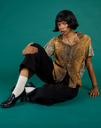 Kira wearing the Leopard Pantry Button Up with the Black Drop Pocket Pants