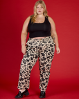 Juliet is 5'7" wearing 2XL Cow Work Pant with the Black Cropped Tank