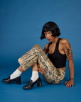 Kira wearing the Tiger Work Pant with the Black Cropped Tank
