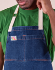 Close up of Full Indigo Denim Apron in dark wash on Isaac