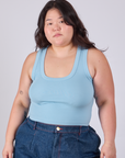 Ashley is 5'7" and wearing L Cropped Tank Top in Baby Blue