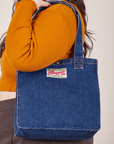 Denim Shopper Tote Bag in Dark Wash worn over model's shoulder