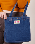 Denim Shopper Tote Bag in Dark Wash on arm of model