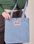 Denim Shopper Tote Bag in Light Wash worn on arm of model