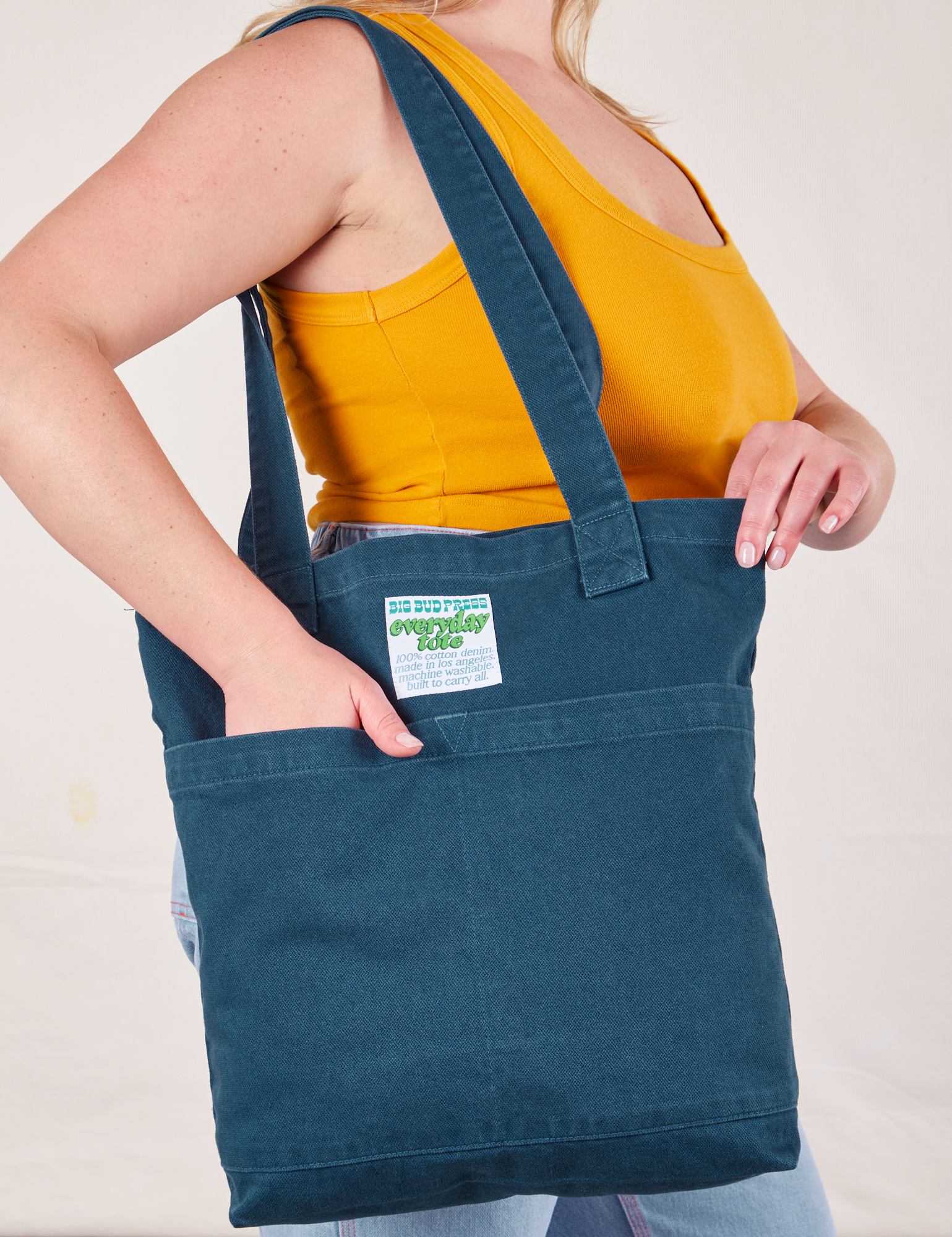 Everyday Tote Bag in Lagoon worn on shoulder of model