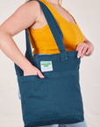 Everyday Tote Bag in Lagoon worn on shoulder of model