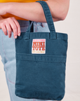Mini Tote Bag in Lagoon worn on arm of model
