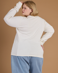 Back view of Juliet wearing the Vintage Tee White Long Sleeve Burly Tee