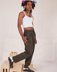 Side view of Heavyweight Trousers in Espresso Brown and vintage off-white Cami on Jerrod