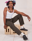 Jerrod is wearing Heavyweight Trousers in Espresso Brown and Cropped Cami in vintage tee off-white