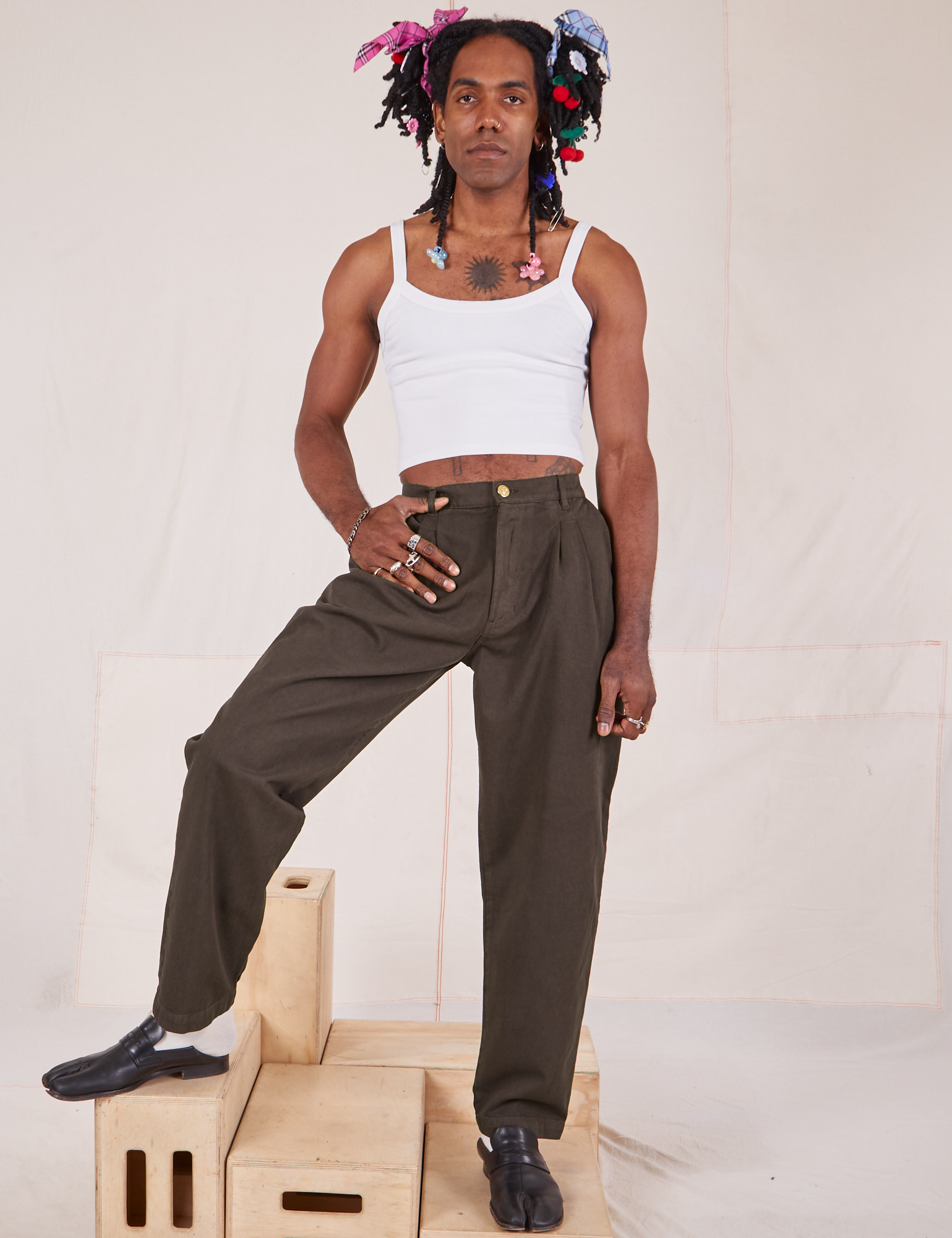 Jerrod is 6&#39;3&quot; and wearing S Long Heavyweight Trousers in Espresso Brown paired with vintage off-white Cami