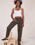 Jerrod is 6'3" and wearing S Long Heavyweight Trousers in Espresso Brown paired with Cropped Cami in vintage tee off-white