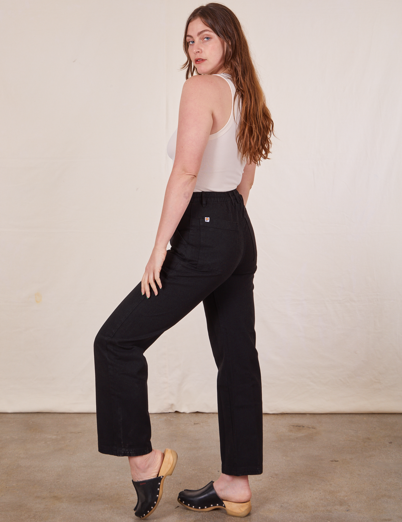 Work Pants in Basic Black side view on Allison wearing a Tank Top in vintage tee off-white