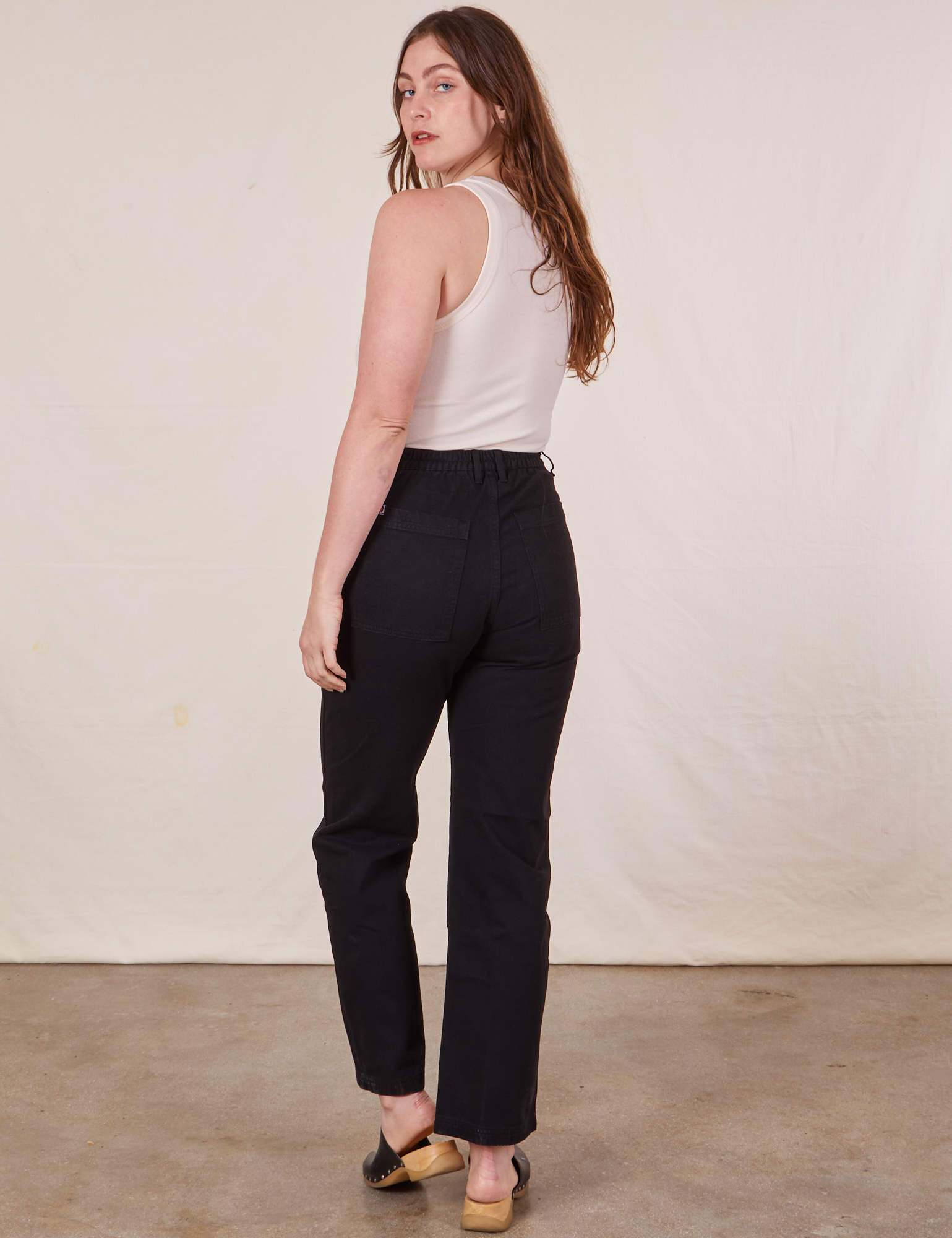 Work Pants in Basic Black back view on Allison wearing a Tank Top in vintage tee off-white