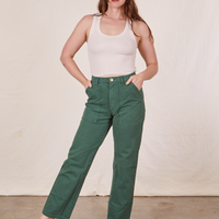 Allison is 5'10" and wearing Long S Work Pants in Dark Emerald Green paired with vintage off-white Tank Top