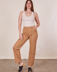 Allison is 5'10" and wearing S Long Work Pants in Tan and Tank Top in vintage tee off-white