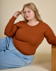 Juliet wearing the Burnt Terracotta Long Sleeve Baby Tee