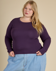 Juliet is 5'7" and wearing L Nebula Long Sleeve Baby Tee