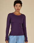 Mika is 5'3" and wearing P Nebula Long Sleeve Baby Tee