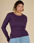 Tiara is 5'4" and wearing XS Nebula Long Sleeve Baby Tee