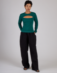 Mika wearing the Hunter Green Long Sleeve Porthole Tee with Black Drop Pocket Pants