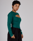 Side view of the Hunter Green Long Sleeve Porthole Tee on Mika