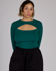 Tiara is wearing the Hunter Green Long Sleeve Porthole Tee tucked in