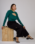 Tiara wearing the Hunter Green Long Sleeve Porthole Tee with lack Drop Pocket Pants