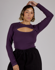 Tiara wearing the Nebula Purple Long Sleeve Porthole Tee tucked in