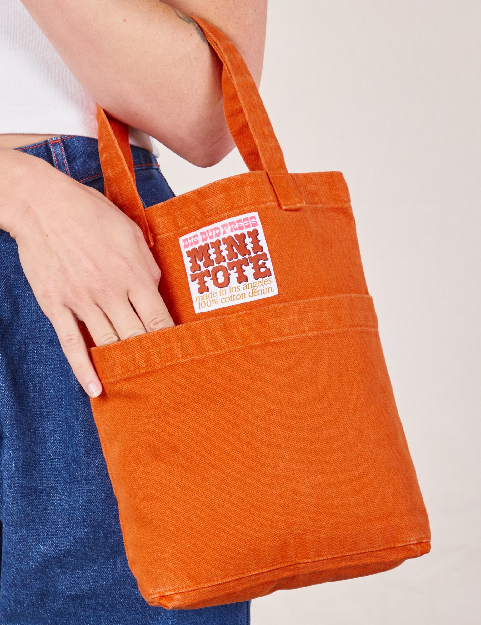 Mini Tote Bag in Burnt Orange on Alex's arm
