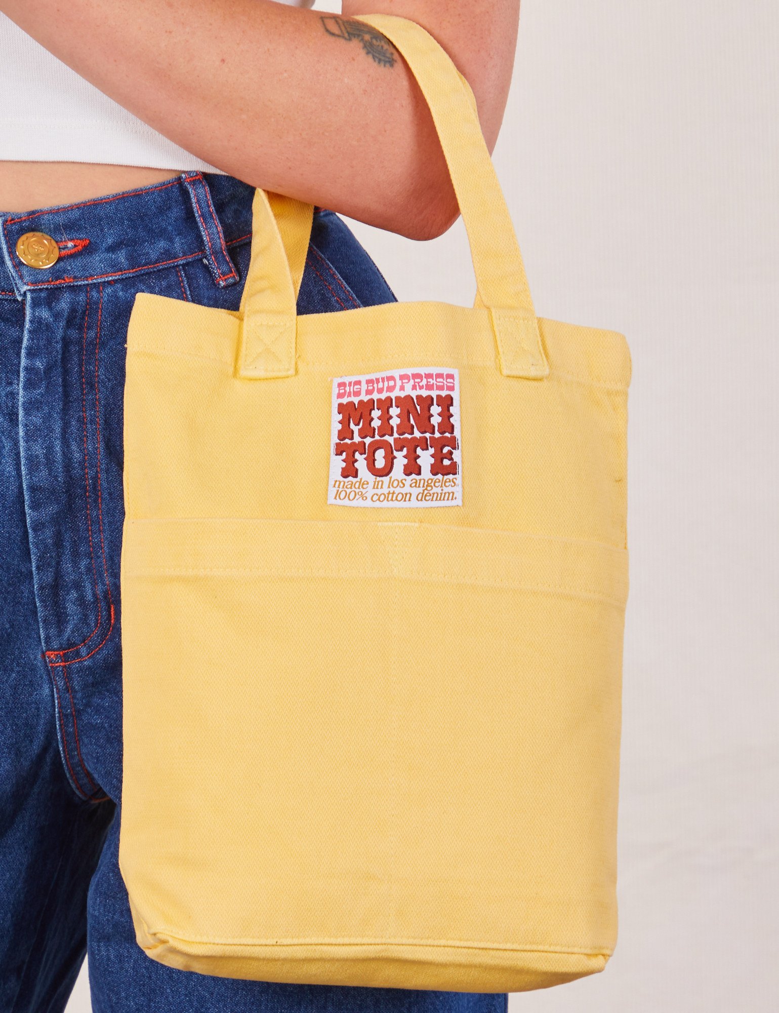 Mini Tote in Butter Yellow on Alex's arm