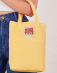 Mini Tote in Butter Yellow on Alex's arm