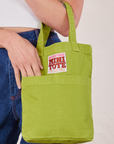 Gross Green Mini Tote Bag on Alex's arm