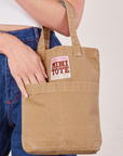 Tan Mini Tote Bag on Alex's arm