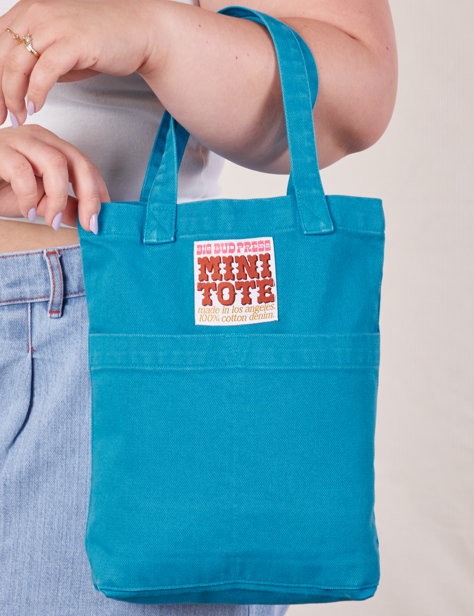 Mini Tote in Hawaiian Blue on Ashley's arm