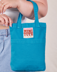 Mini Tote in Hawaiian Blue on Ashley's arm