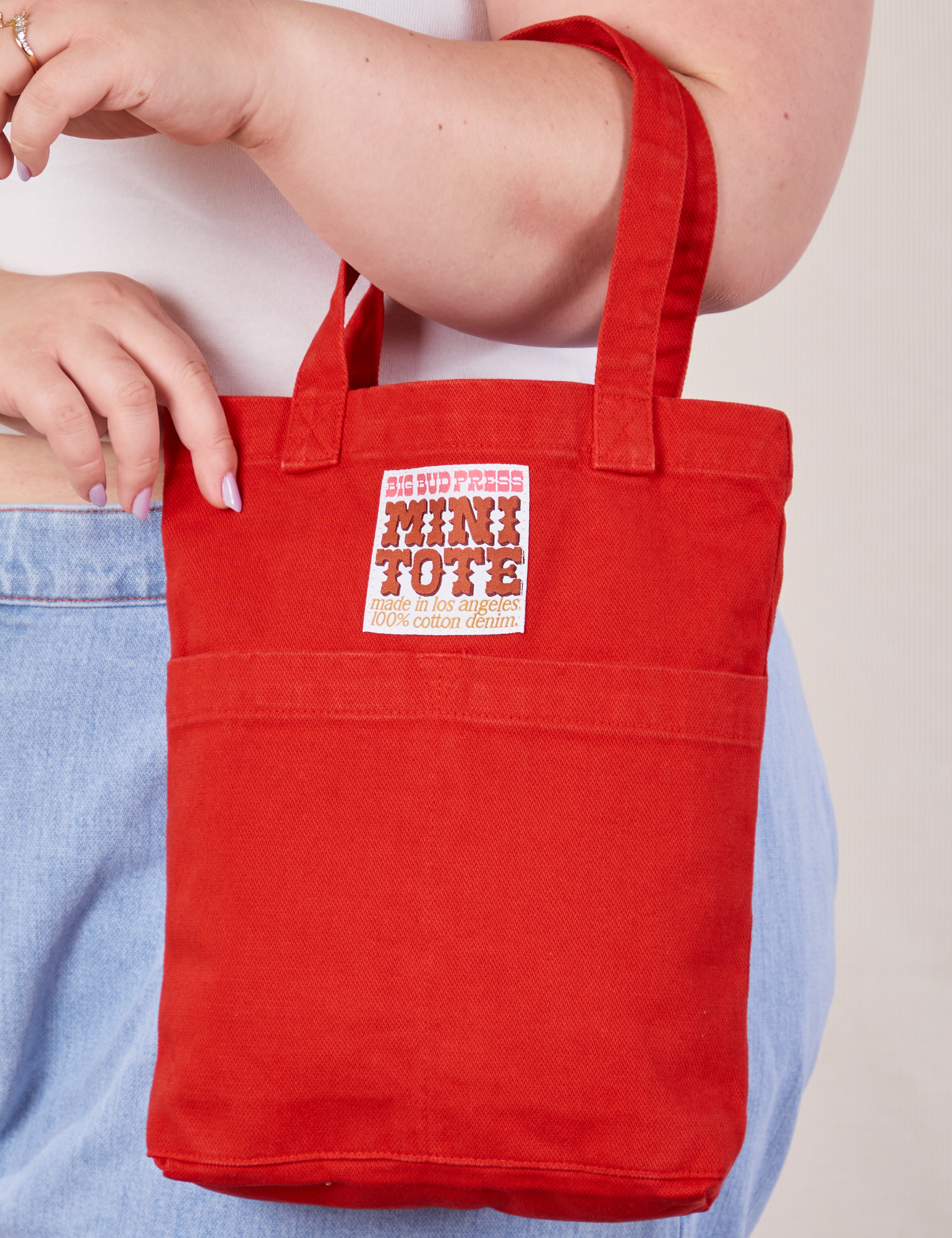 Mini Tote Bag in mustang red on Ashley's arm