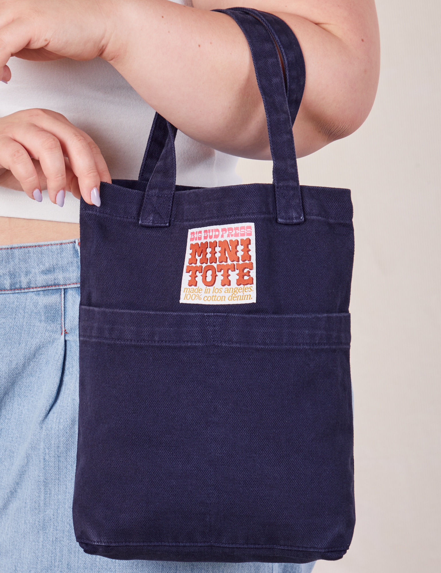 Navy Blue Mini Tote Bag on Ashley's arm