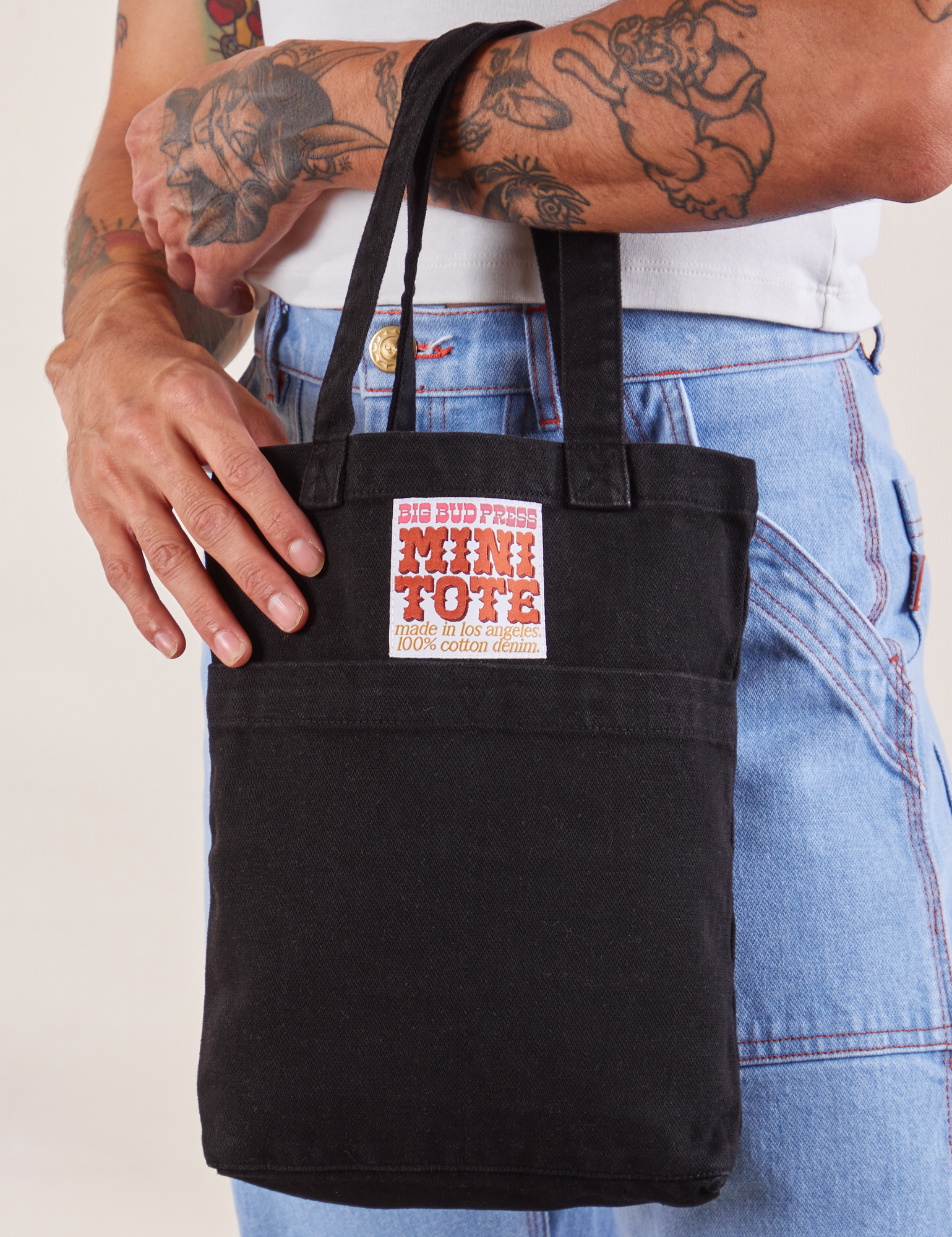 Black Mini Tote Bag on Jesse's arm