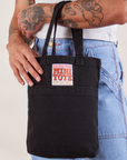 Black Mini Tote Bag on Jesse's arm