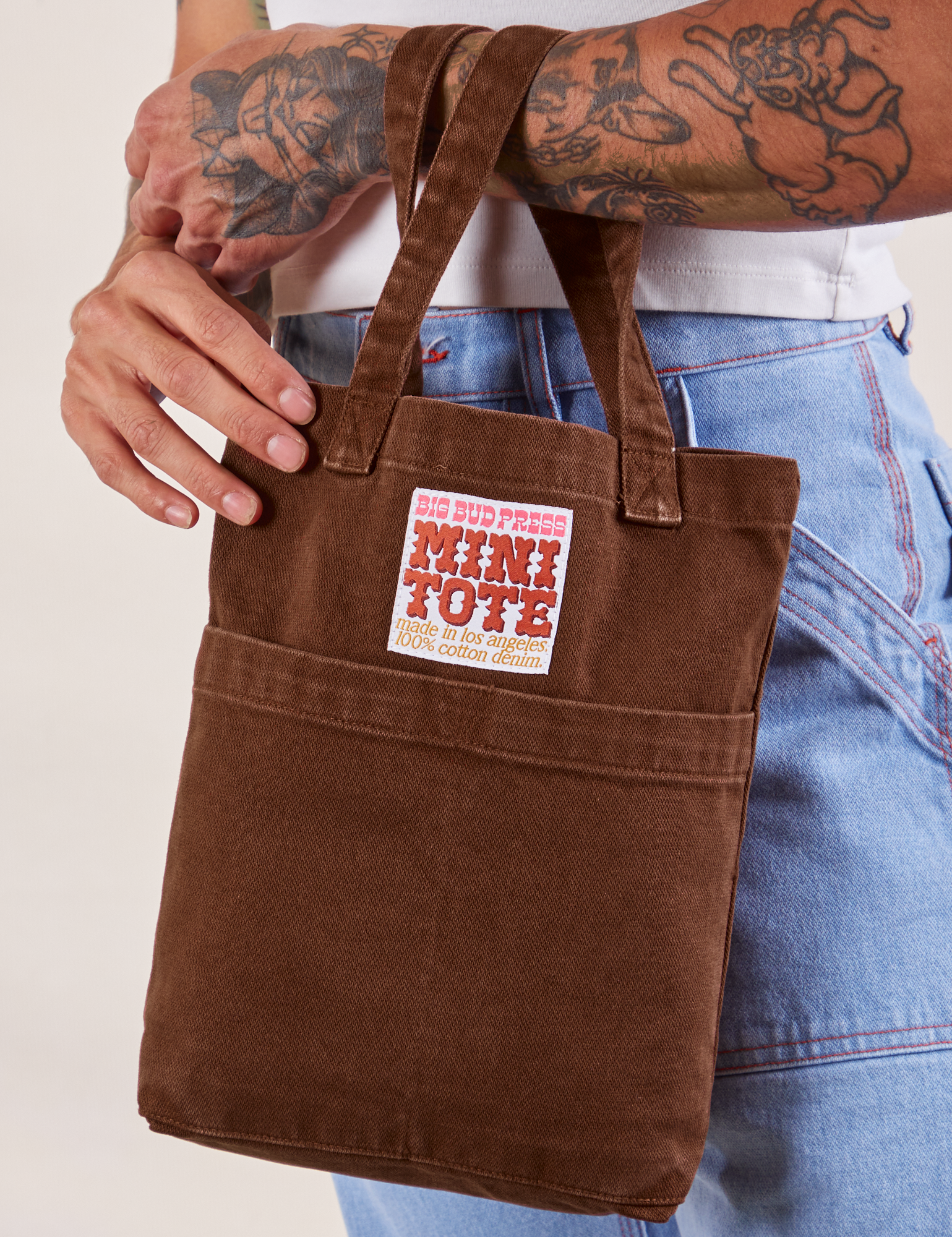 Fudgesicle Brown Mini Tote Bag on Jesse's arm