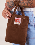 Fudgesicle Brown Mini Tote Bag on Jesse's arm