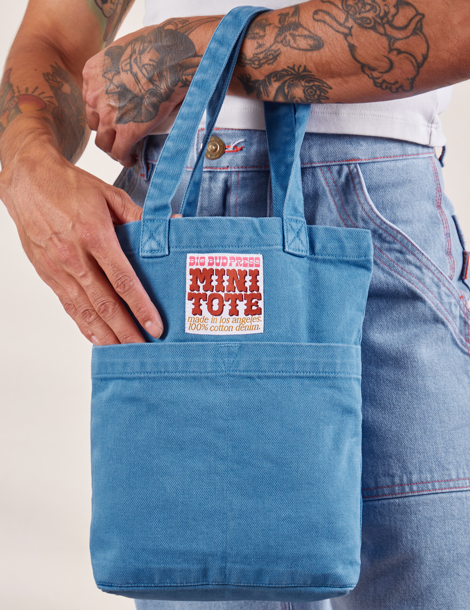 Greek Blue Mini Tote Bag on Jesse's arm