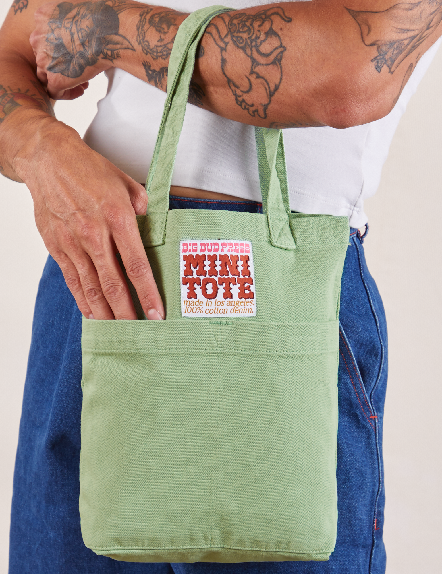 Sage Green Mini Tote Bag on Jesse's arm