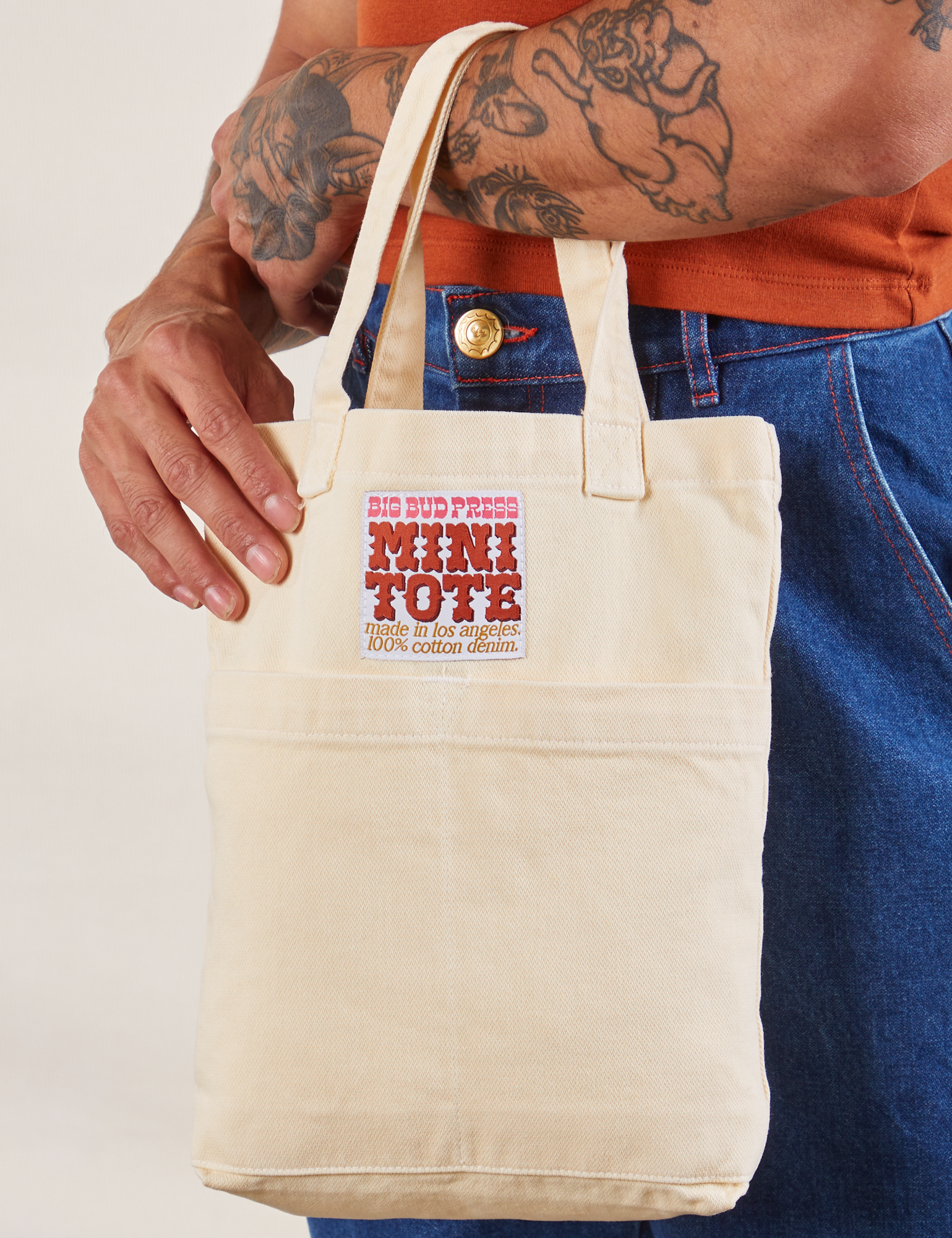 Vintage Tee Off-White Mini Tote Bag on Jesse's arm