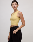 Angled side view of the Butter Yellow Deep Cut Racerback on Alex