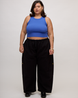 Kristen is wearing the Cornflower Blue Deep Cut Racerback with Black Drop Pocket Pants