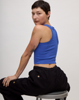 Angled back view of the Cornflower Blue Deep Cut Racerback on Alex
