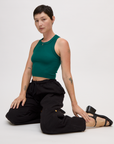 Alex wearing the Hunter Green Deep Cut Racerback with Black Drop Pocket Pants